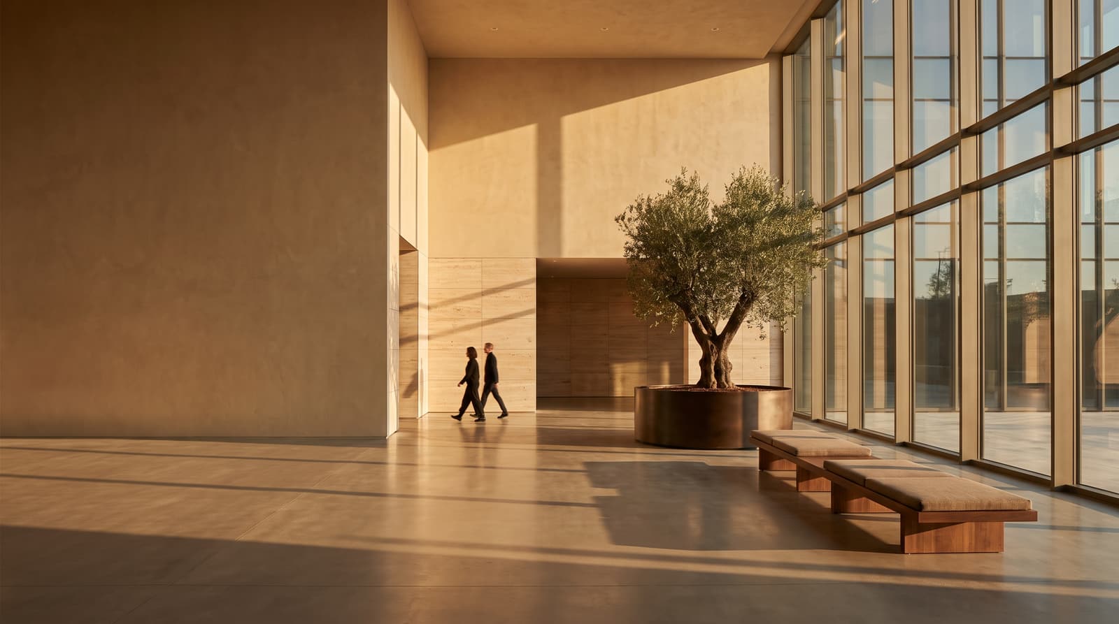 A contemporary corporate lobby in warm stone and plaster